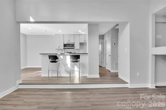 a kitchen that has a sink and a stove in it