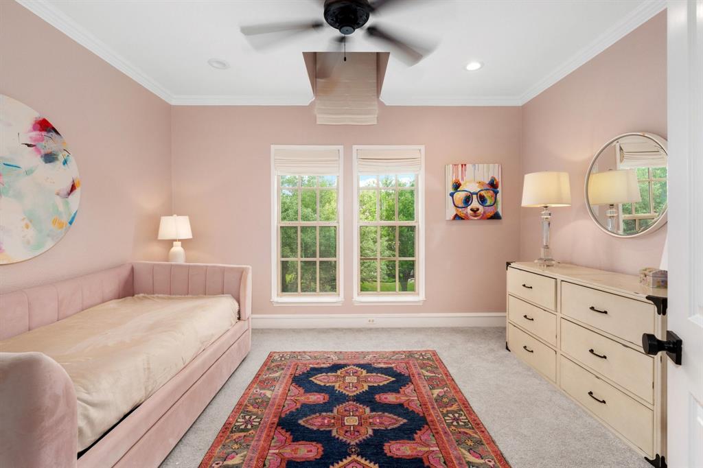 2101 Vail Road Southlake, TX 76092 - Photo 28 of 40 a bedroom with a bed and window with lamp