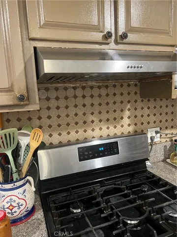 a close view of a stove a microwave and a cabinets