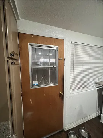 a view of a door and a window