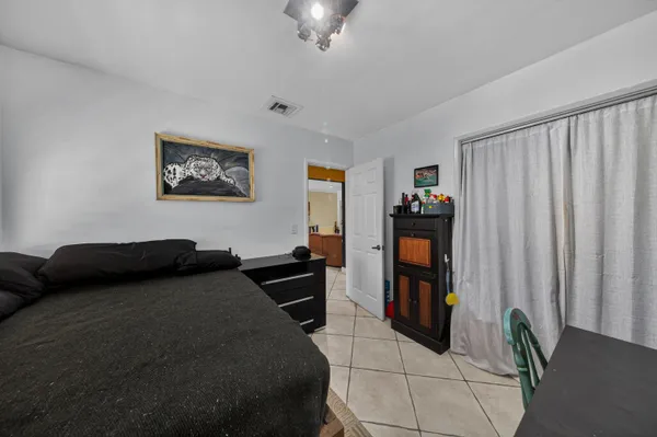 a bedroom with furniture and a bed
