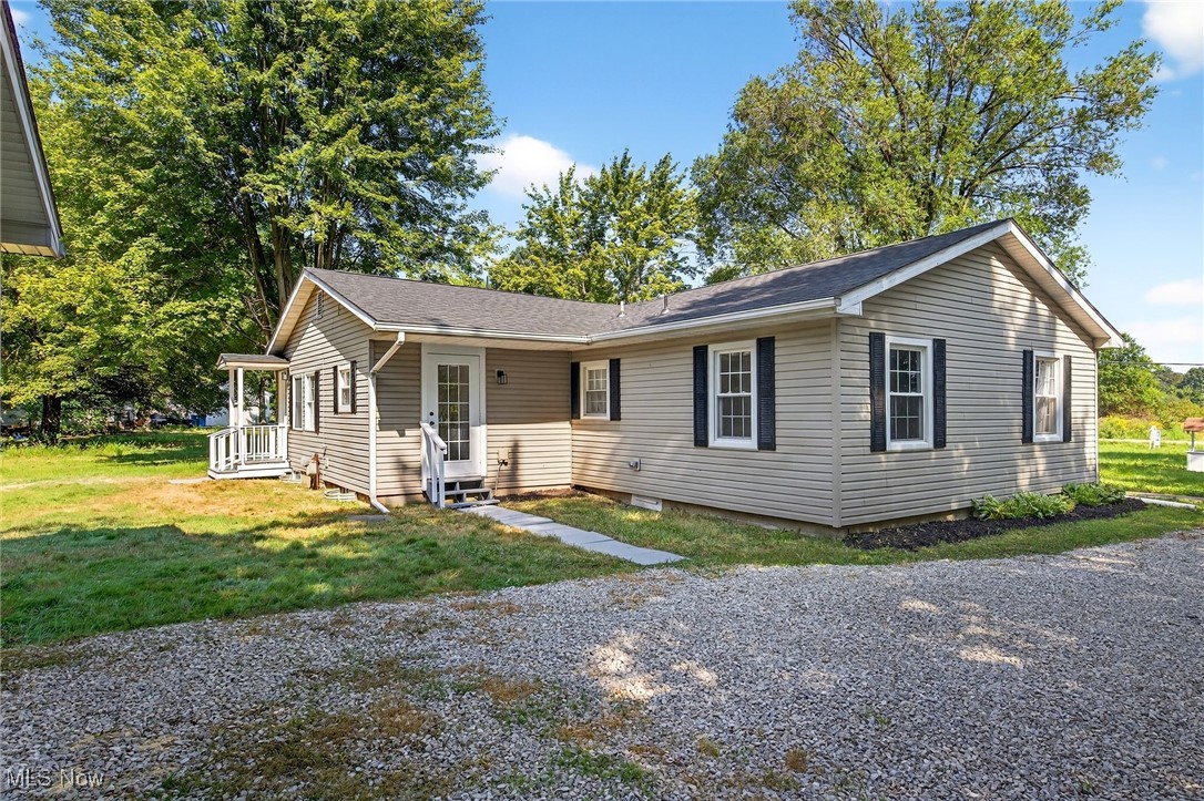 8230 Drake State Line Road Masury, OH 44438 - Photo 5 of 47 View of front of home featuring a front lawn and roof with shingles