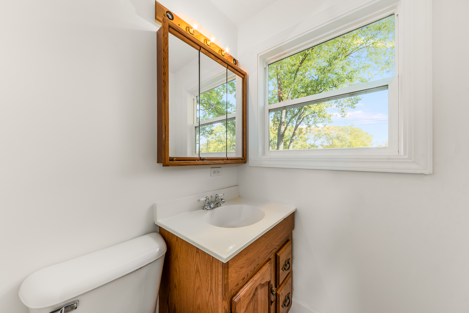 116 North Pinecrest Road Bolingbrook, IL 60440 - Photo 11 of 16 a bathroom with a sink toilet and a window