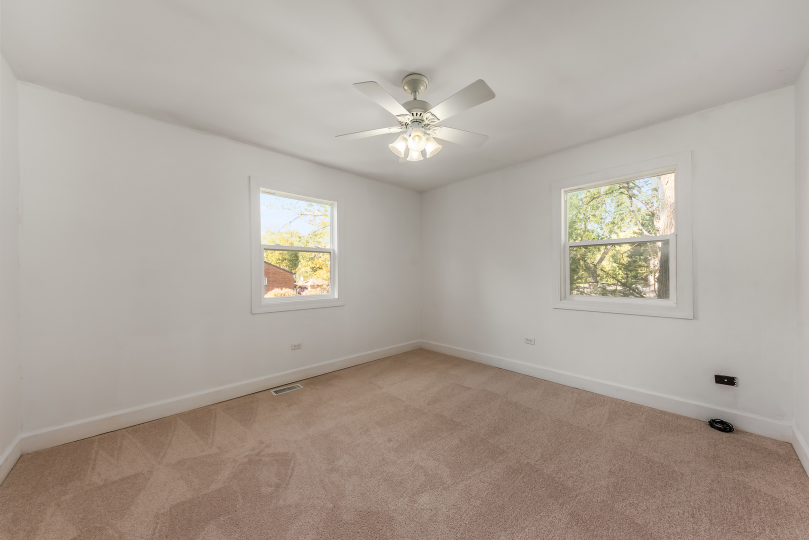 116 North Pinecrest Road Bolingbrook, IL 60440 - Photo 12 of 16 an empty room with windows and fan