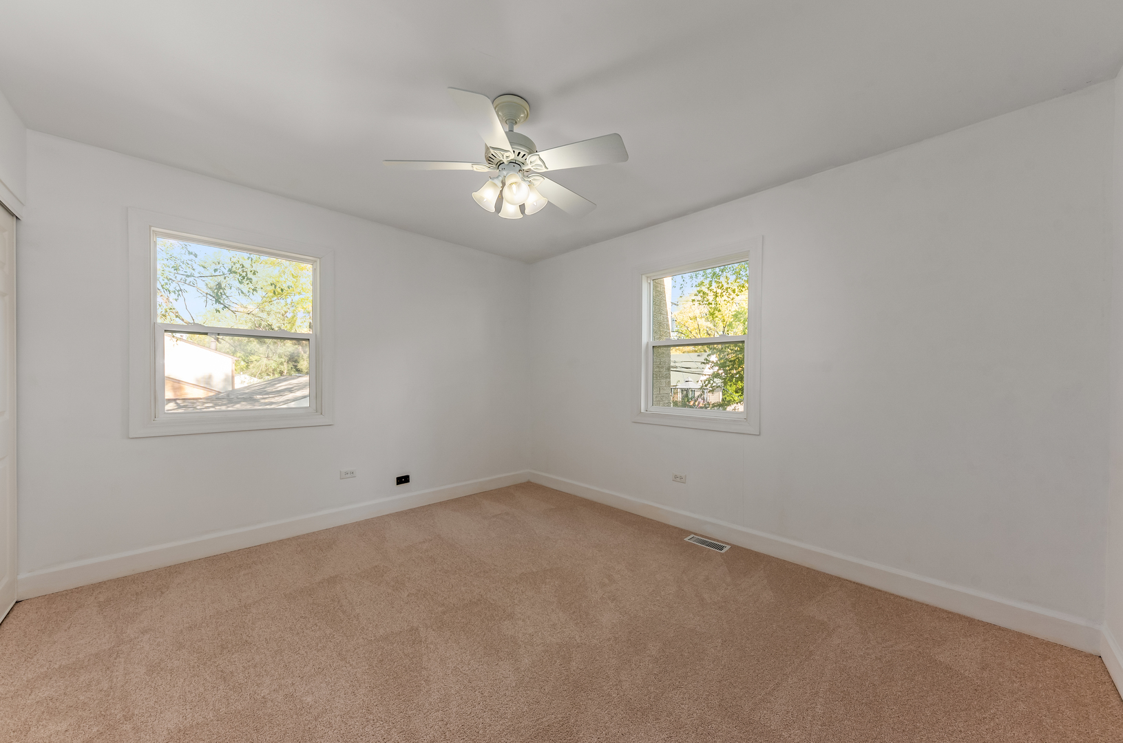 116 North Pinecrest Road Bolingbrook, IL 60440 - Photo 13 of 16 an empty room with windows and fan