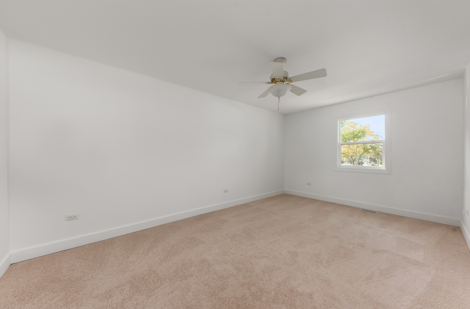 116 North Pinecrest Road Bolingbrook, IL 60440 - Photo 15 of 16 an empty room with a window and a ceiling fan