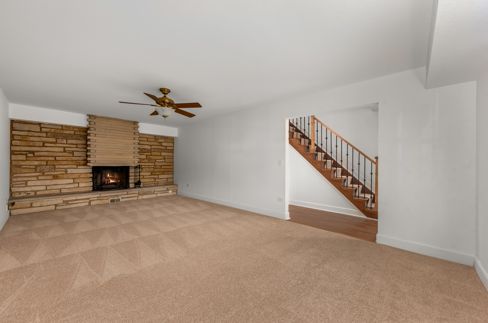 116 North Pinecrest Road Bolingbrook, IL 60440 - Photo 3 of 16 a view of an empty room with a fireplace