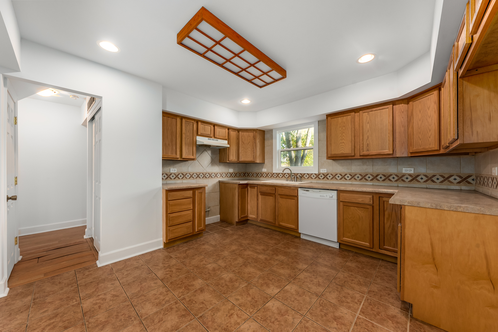 116 North Pinecrest Road Bolingbrook, IL 60440 - Photo 5 of 16 a kitchen with a refrigerator sink and cabinets