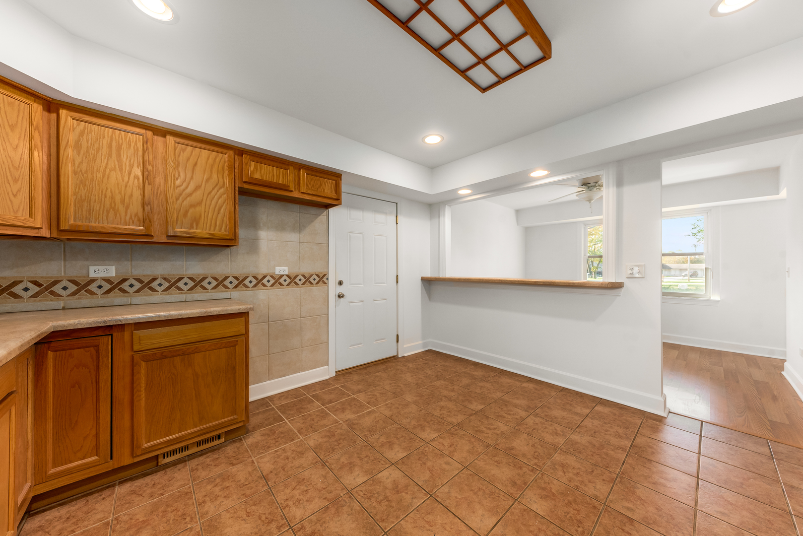 116 North Pinecrest Road Bolingbrook, IL 60440 - Photo 6 of 16 a kitchen with stainless steel appliances granite countertop a refrigerator and a stove top oven