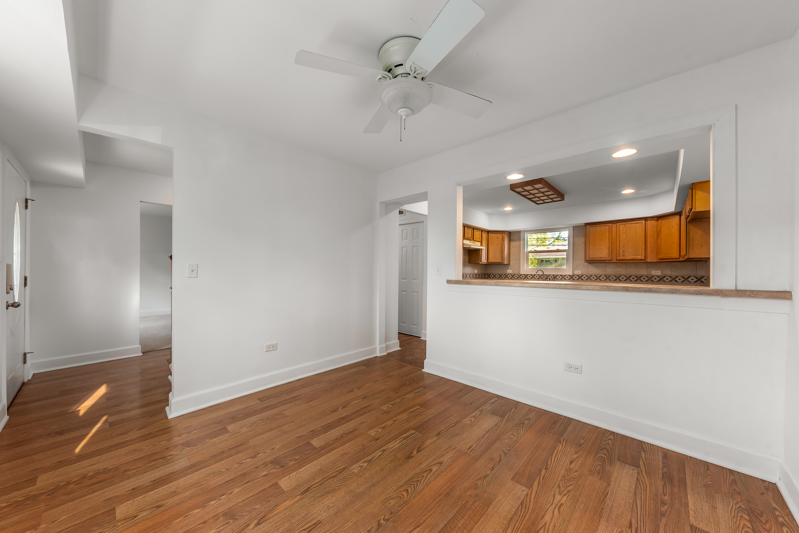 116 North Pinecrest Road Bolingbrook, IL 60440 - Photo 7 of 16 wooden floor in an empty room with a window