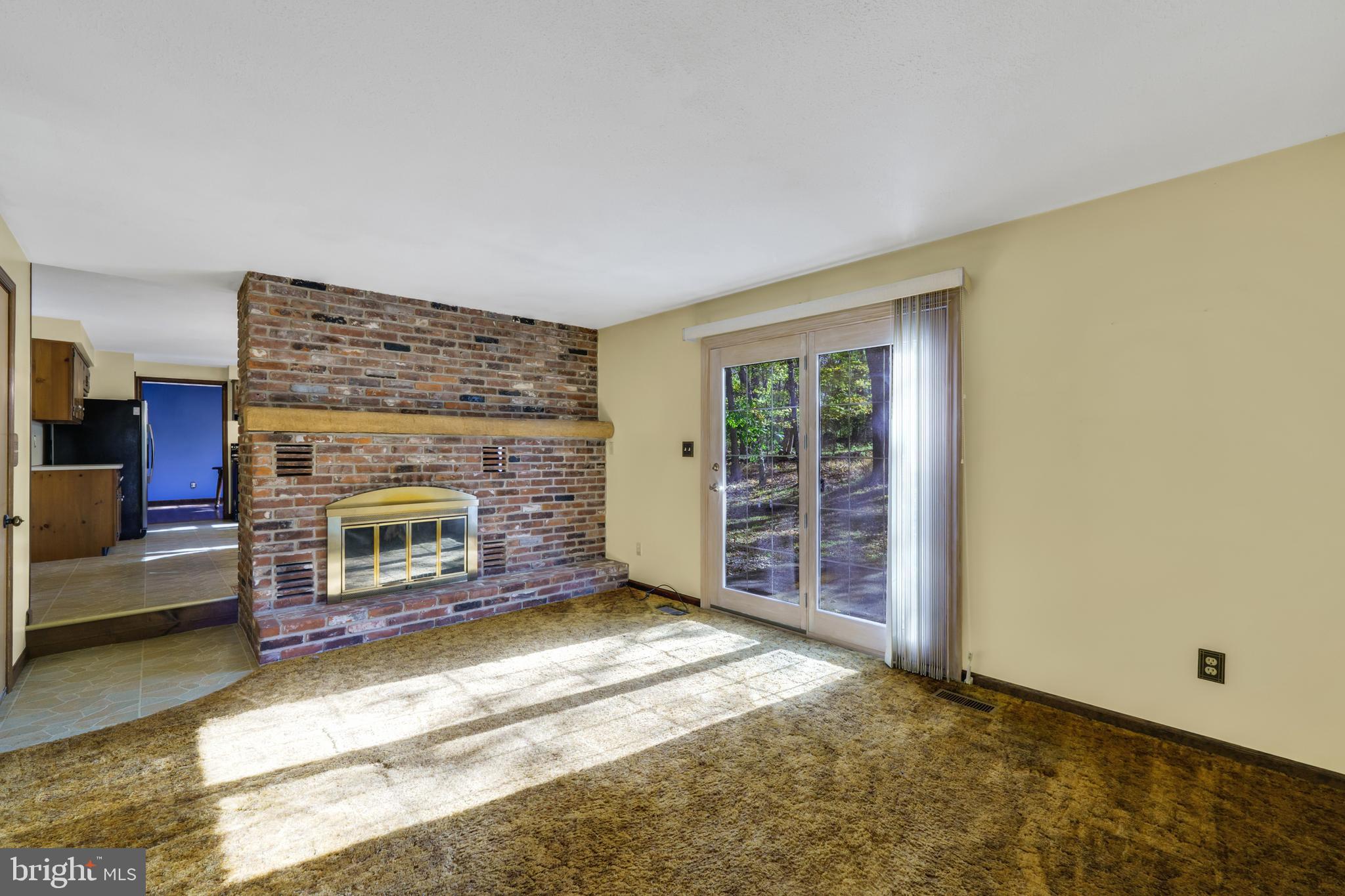 2333 Three Mile Run Road Perkasie, PA 18944 - Photo 12 of 43 a view of an empty room with a fireplace and a window