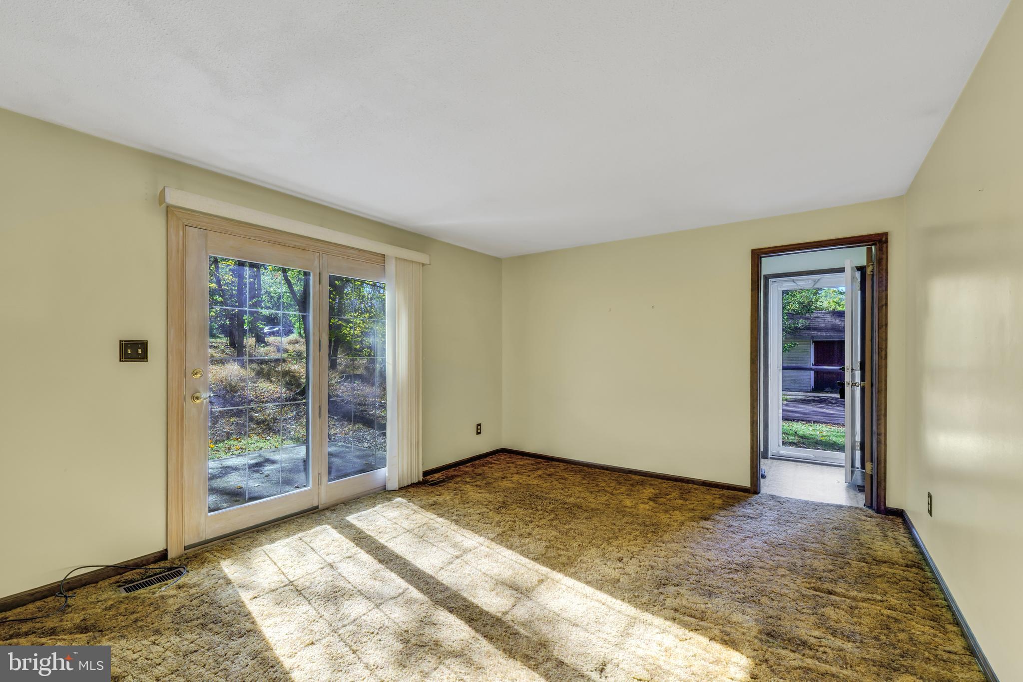 2333 Three Mile Run Road Perkasie, PA 18944 - Photo 14 of 43 a view of an empty room with window and wooden floor