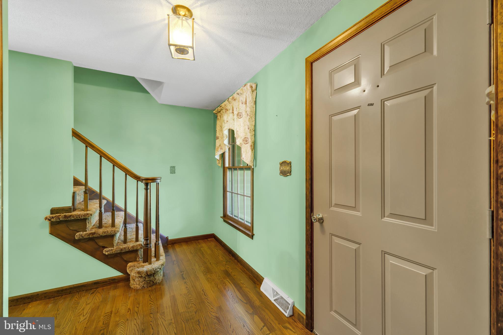 2333 Three Mile Run Road Perkasie, PA 18944 - Photo 23 of 43 a view of a hallway with wooden floor and staircase