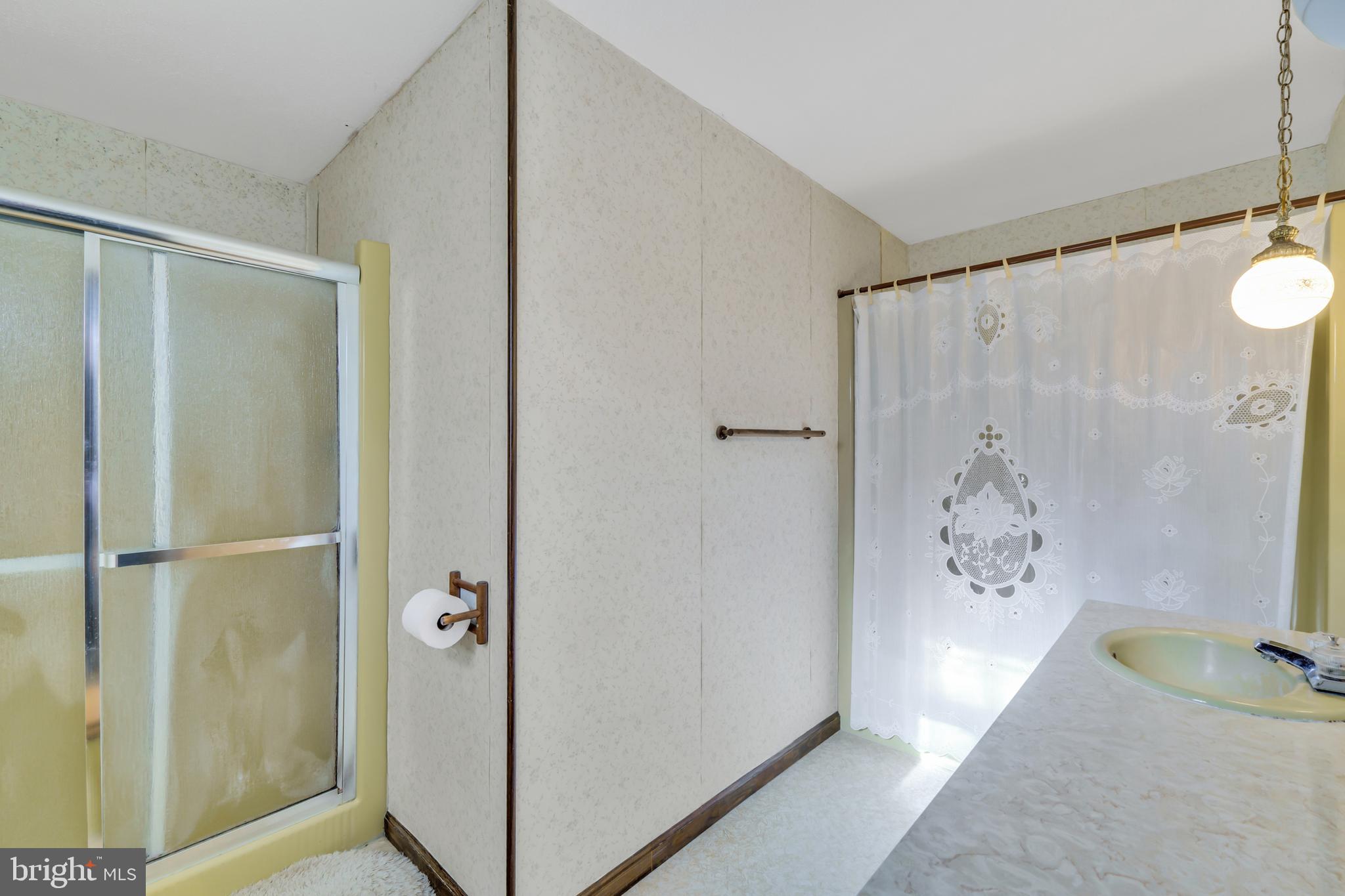 2333 Three Mile Run Road Perkasie, PA 18944 - Photo 28 of 43 a bathroom with a shower and a sink