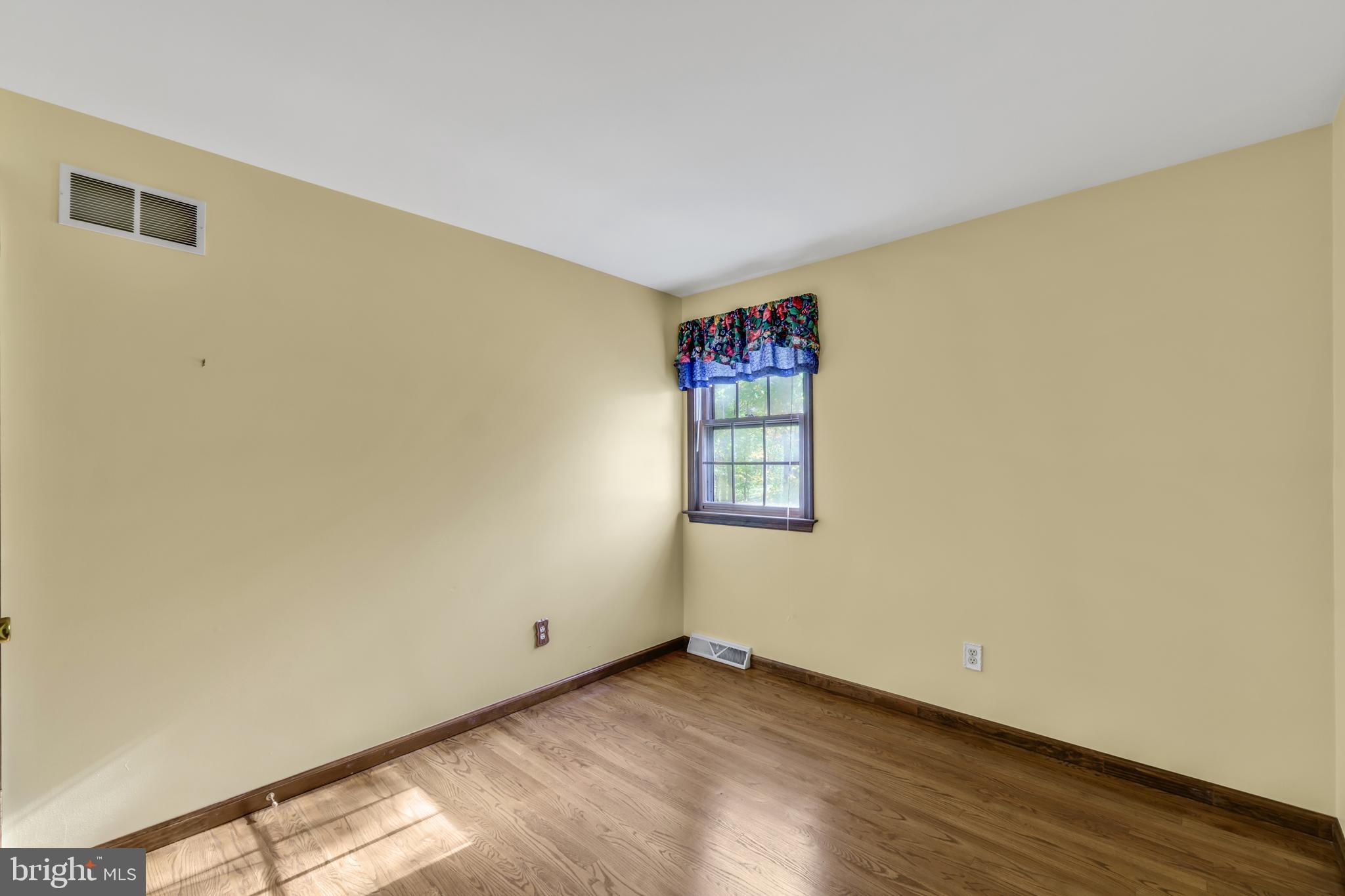 2333 Three Mile Run Road Perkasie, PA 18944 - Photo 34 of 43 a view of an empty room with wooden floor and a window