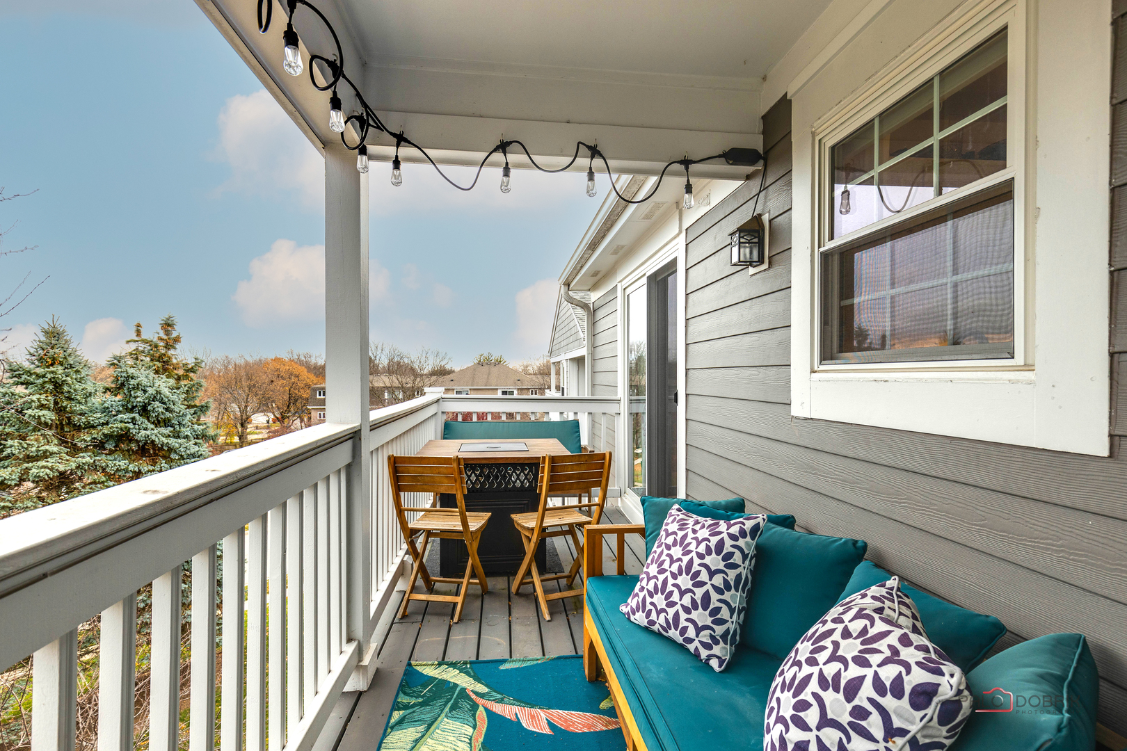 122 East Winchester Road, Unit E Libertyville, IL 60048 - Photo 11 of 17 a balcony view with chairs and table