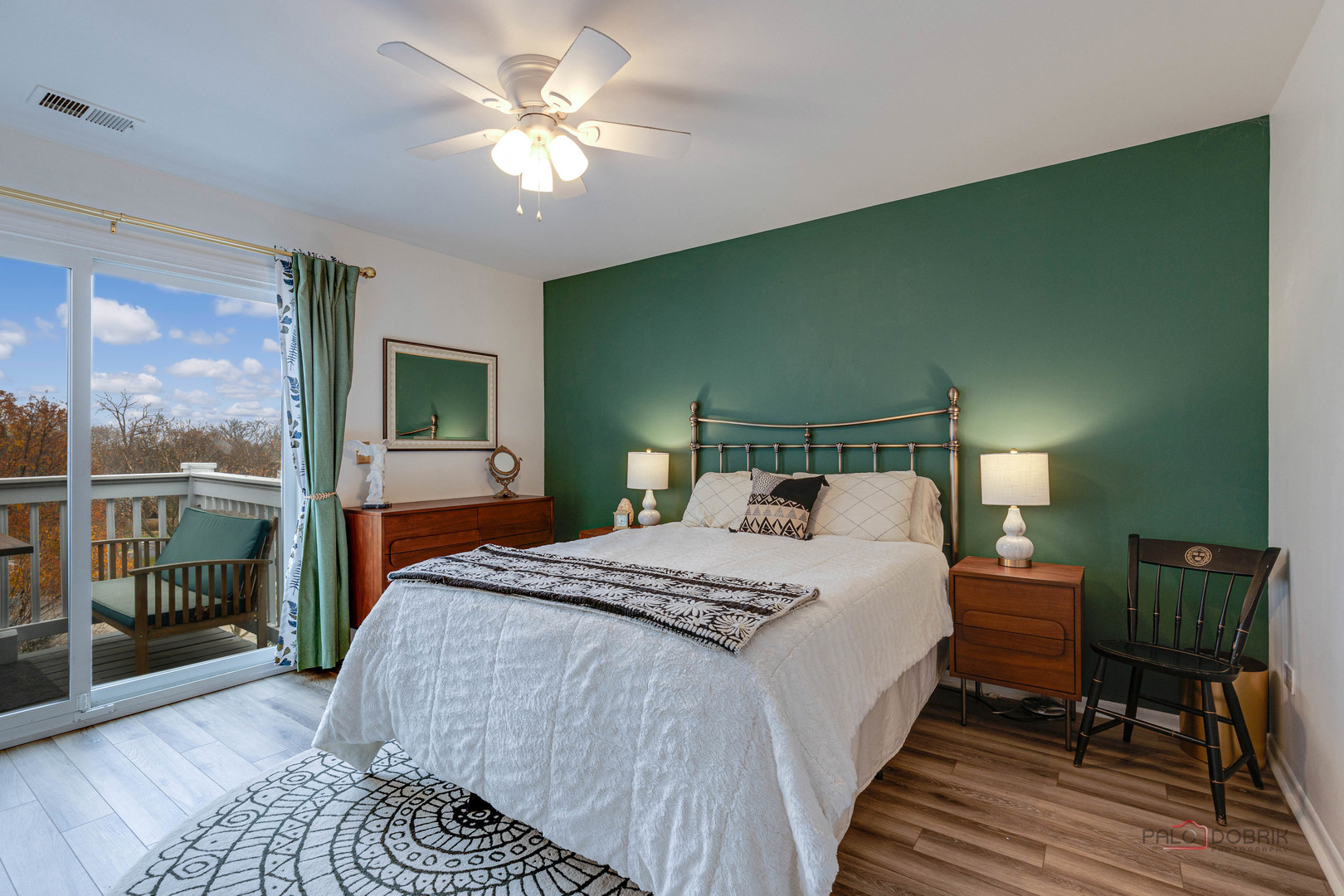 122 East Winchester Road, Unit E Libertyville, IL 60048 - Photo 8 of 17 a bedroom with a large bed a chandelier and windows