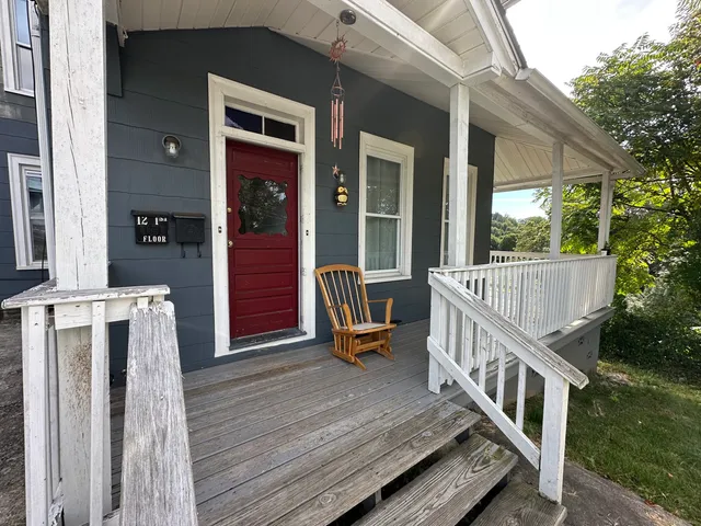 a balcony with view of outdoor space