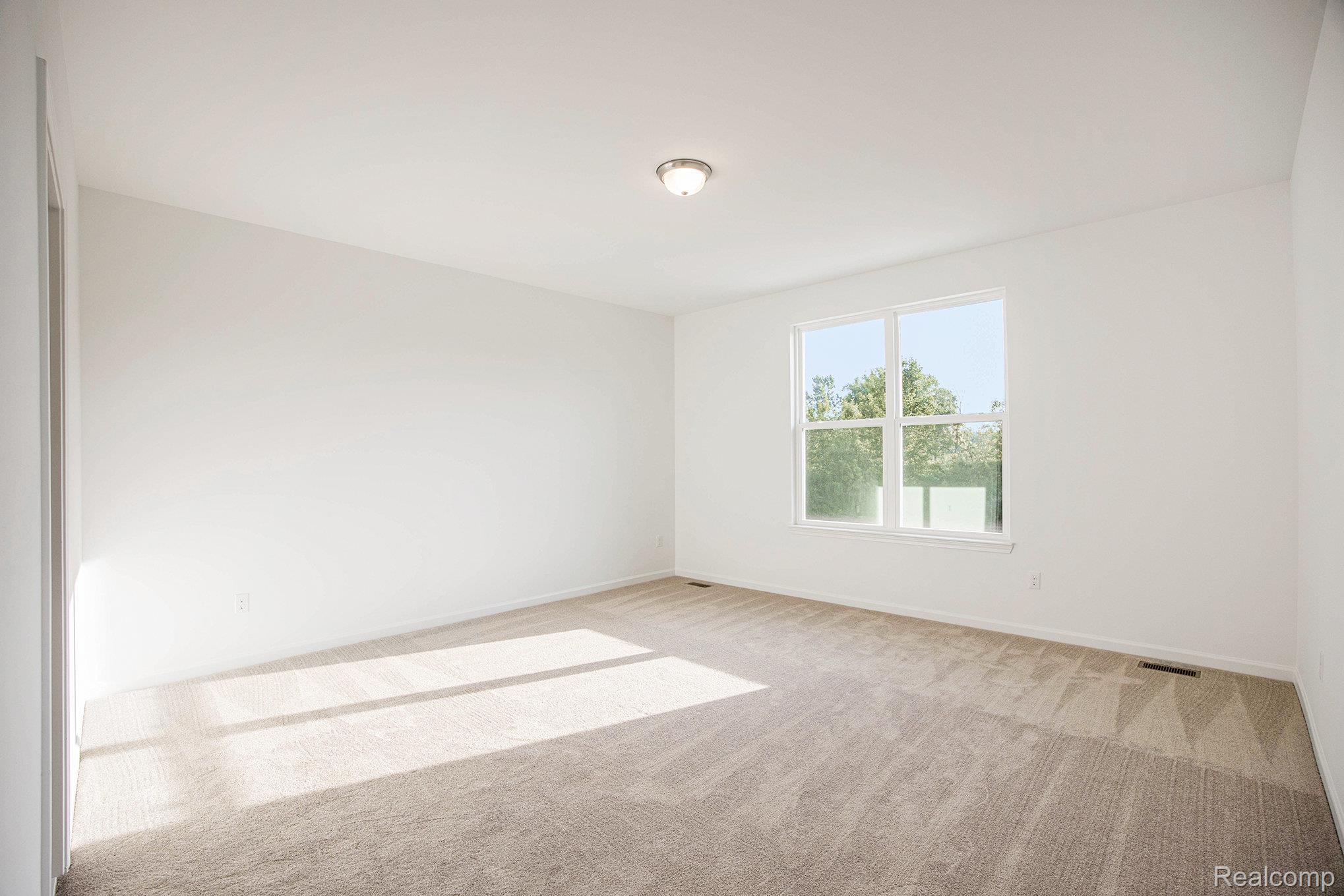 68788 Place Road New Haven, MI 48050 - Photo 17 of 29 Carpeted empty room with baseboards