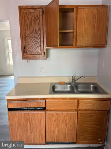 a kitchen with a sink and cabinets