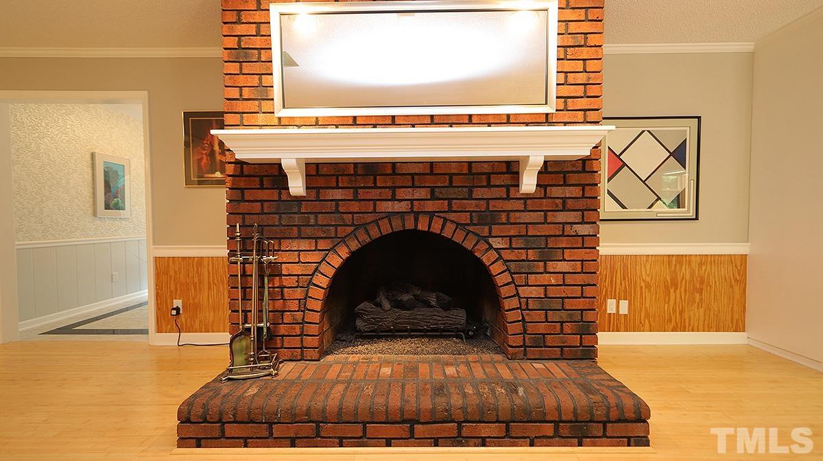 9627 Barton Creek Road Raleigh, NC 27615 - Photo 13 of 30 a living room with a fireplace