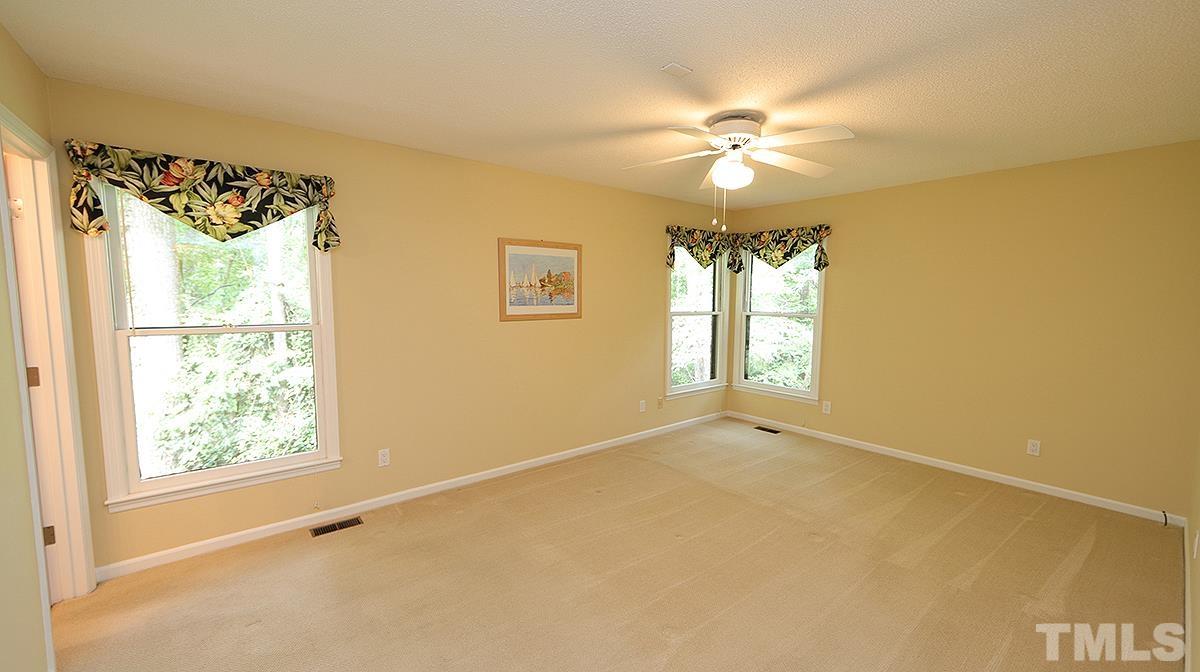 9627 Barton Creek Road Raleigh, NC 27615 - Photo 15 of 30 a view of an empty room with a window