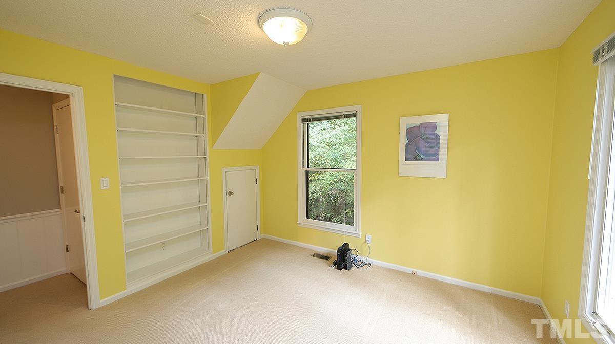 9627 Barton Creek Road Raleigh, NC 27615 - Photo 18 of 30 a view of an empty room with a window