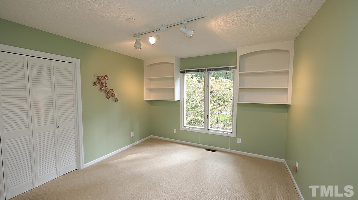9627 Barton Creek Road Raleigh, NC 27615 - Photo 19 of 30 a view of an empty room with a window