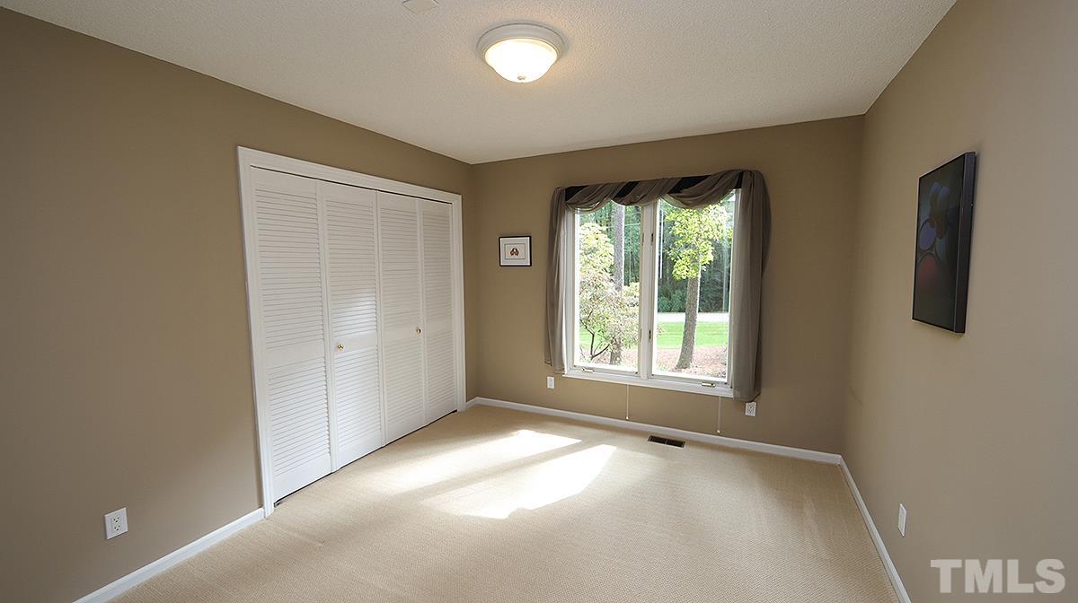 9627 Barton Creek Road Raleigh, NC 27615 - Photo 20 of 30 an empty room with a empty space and windows