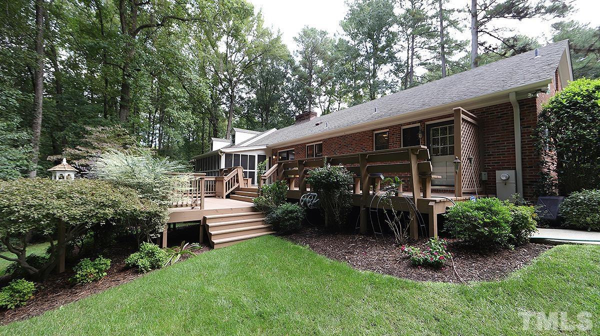 9627 Barton Creek Road Raleigh, NC 27615 - Photo 30 of 30 a front view of a house with a garden