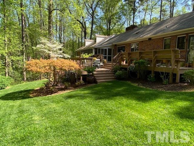 9627 Barton Creek Road Raleigh, NC 27615 - Photo 4 of 30 a view of a house with a yard