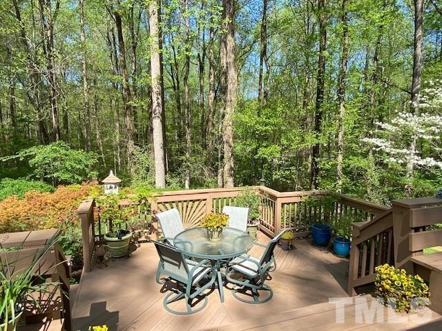 9627 Barton Creek Road Raleigh, NC 27615 - Photo 6 of 30 a view of balcony with furniture and trees