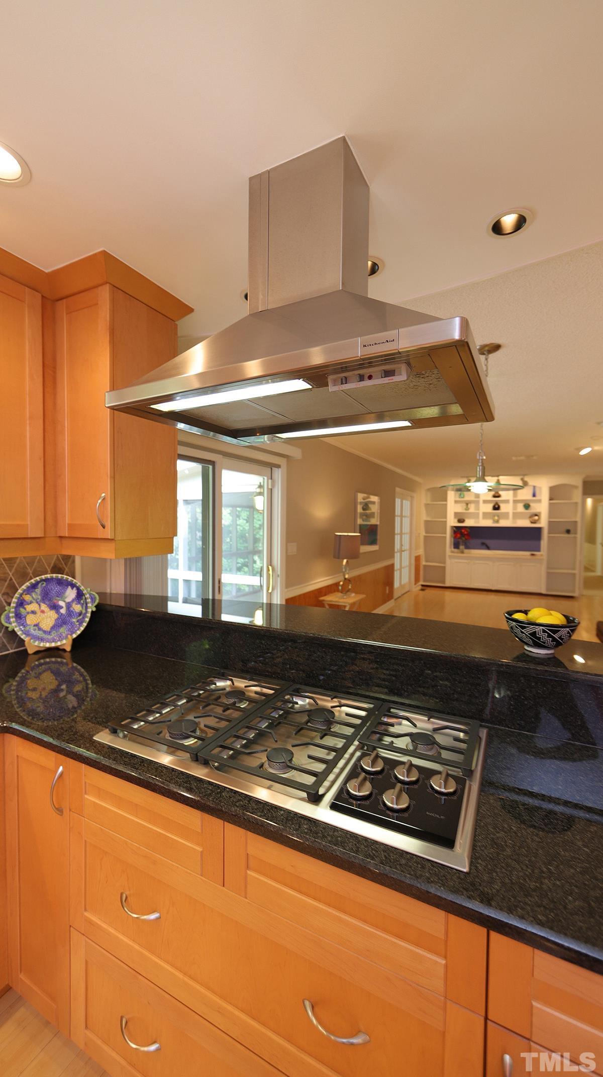 9627 Barton Creek Road Raleigh, NC 27615 - Photo 8 of 30 a stove top oven sitting inside of a kitchen