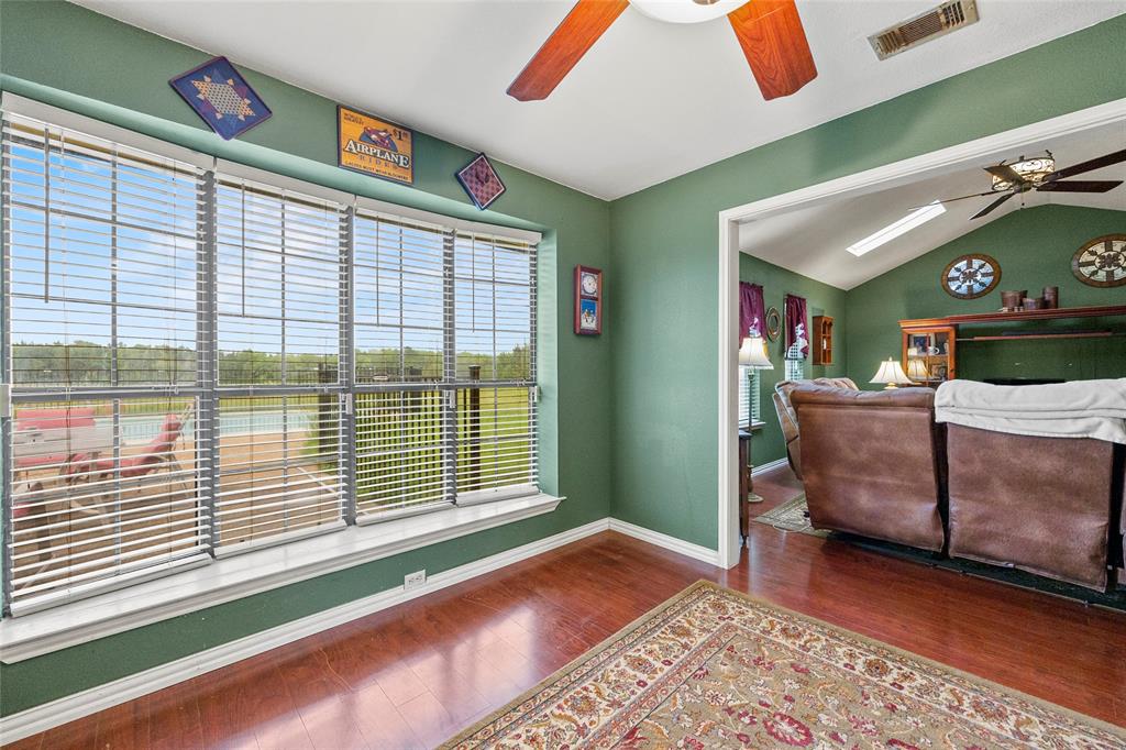 482 Prince Lane Fate, TX 75087 - Photo 12 of 32 a living room with furniture and a large window