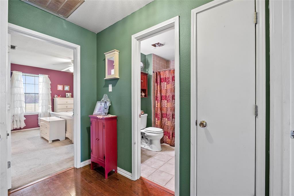 482 Prince Lane Fate, TX 75087 - Photo 16 of 32 a bathroom with a bathtub and a shower
