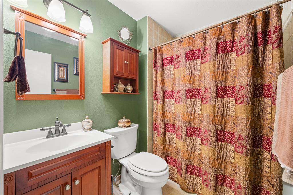 482 Prince Lane Fate, TX 75087 - Photo 21 of 32 a bathroom with a sink and a toilet
