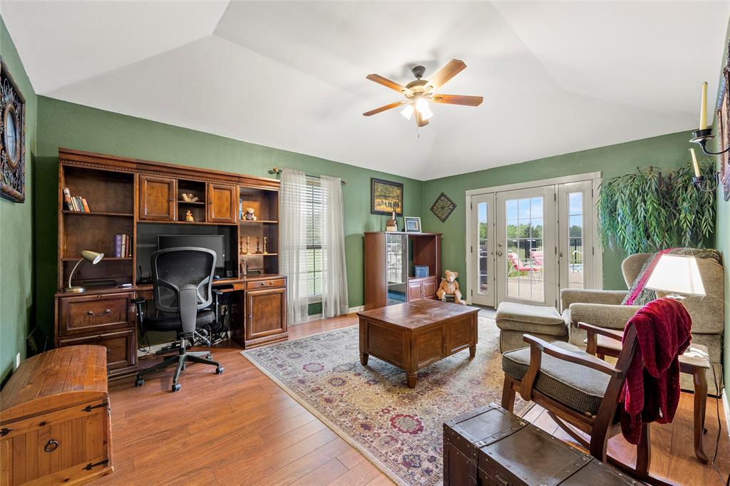 482 Prince Lane Fate, TX 75087 - Photo 25 of 32 a living room with fireplace furniture and a flat screen tv