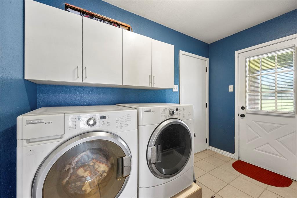 482 Prince Lane Fate, TX 75087 - Photo 28 of 32 a utility room with dryer and washer