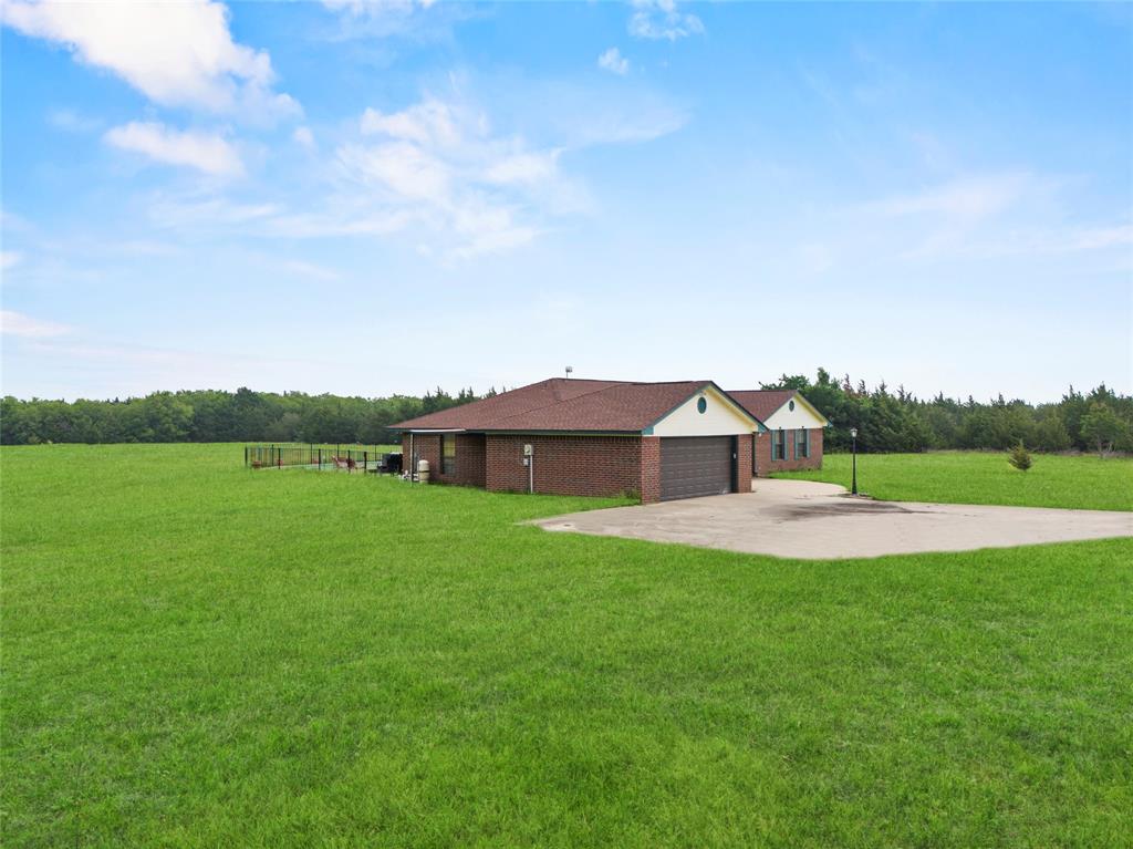 482 Prince Lane Fate, TX 75087 - Photo 5 of 32 a view of a house with a big yard