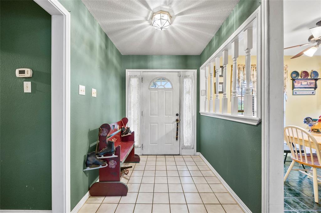 482 Prince Lane Fate, TX 75087 - Photo 7 of 32 a view of an entryway with a workspace