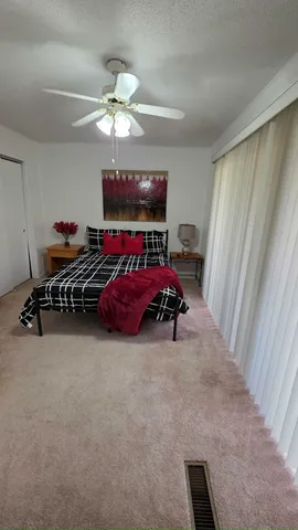 a view of a livingroom with furniture and a window