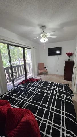 a bedroom with a bed and a walk in closet