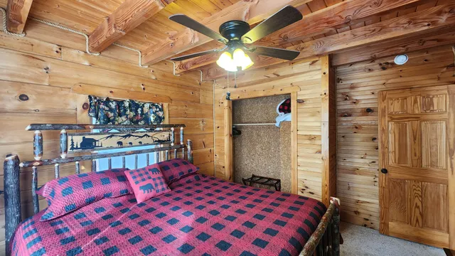 a bedroom with a bed and a walk in closet