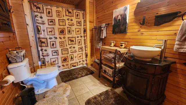 a kitchen with refrigerator and cabinets