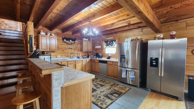 a dining room with furniture and a flat screen tv