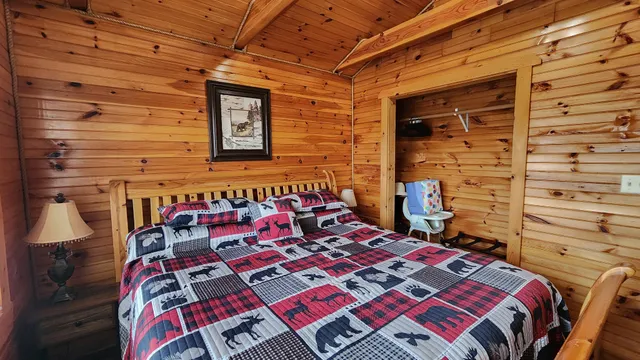 a bed sitting in a bedroom next to a window