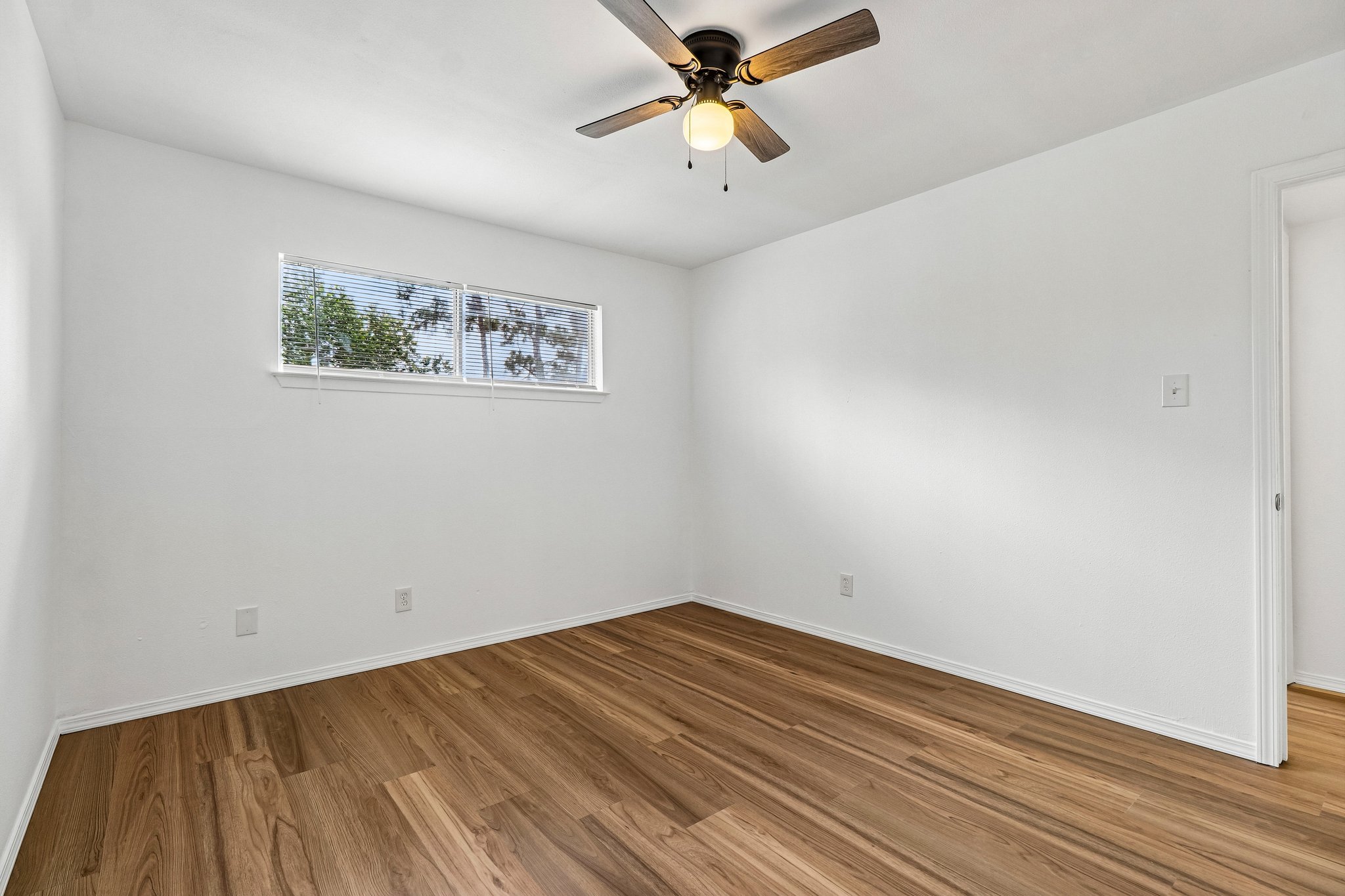 5809 Coventry Lane Austin, TX 78723 - Photo 15 of 35 Upstairs beedroom with wood plank flooring