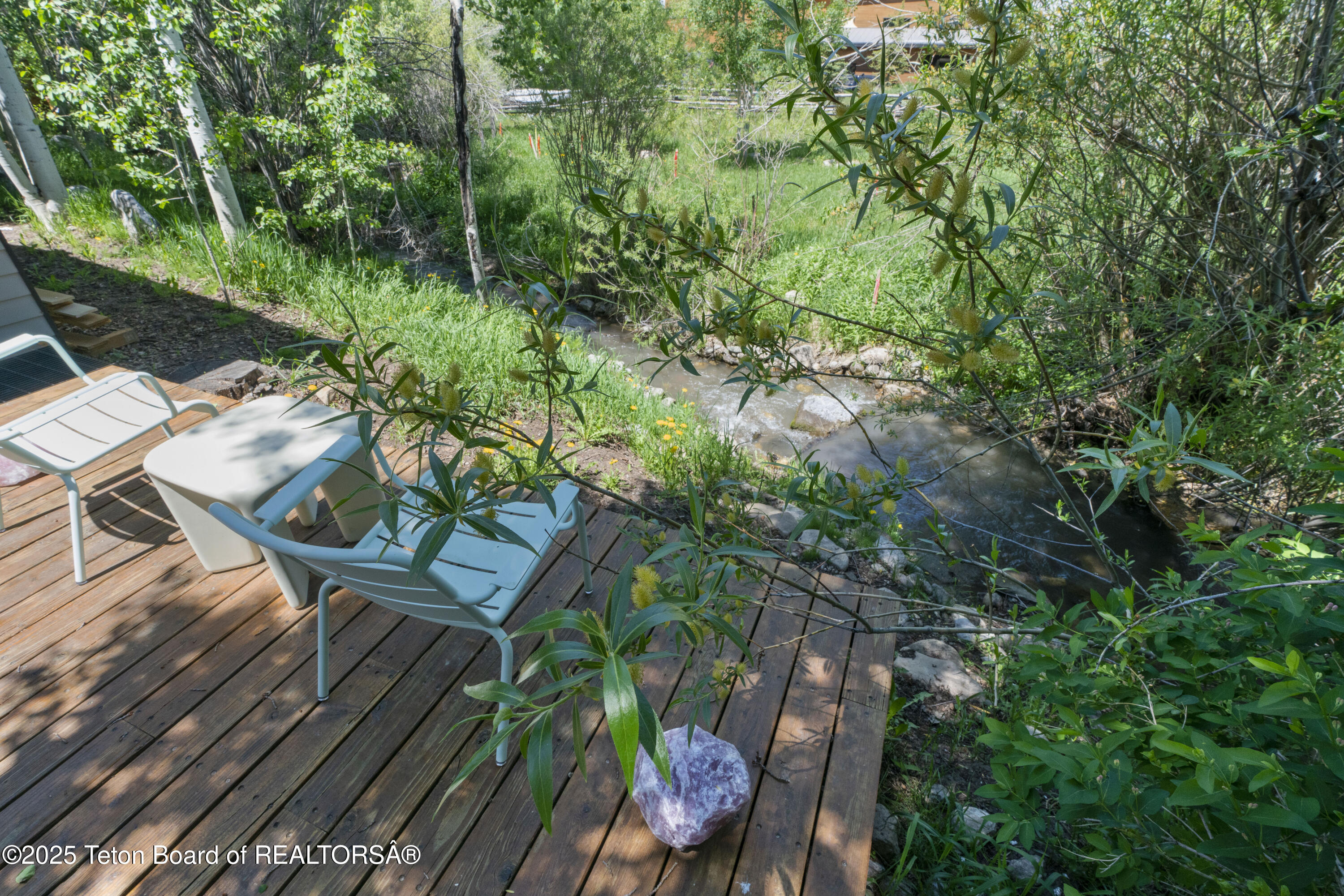 725 Cache Creek Drive Jackson, WY 83001 - Photo 32 of 36 Back Deck Overlooking the Creek