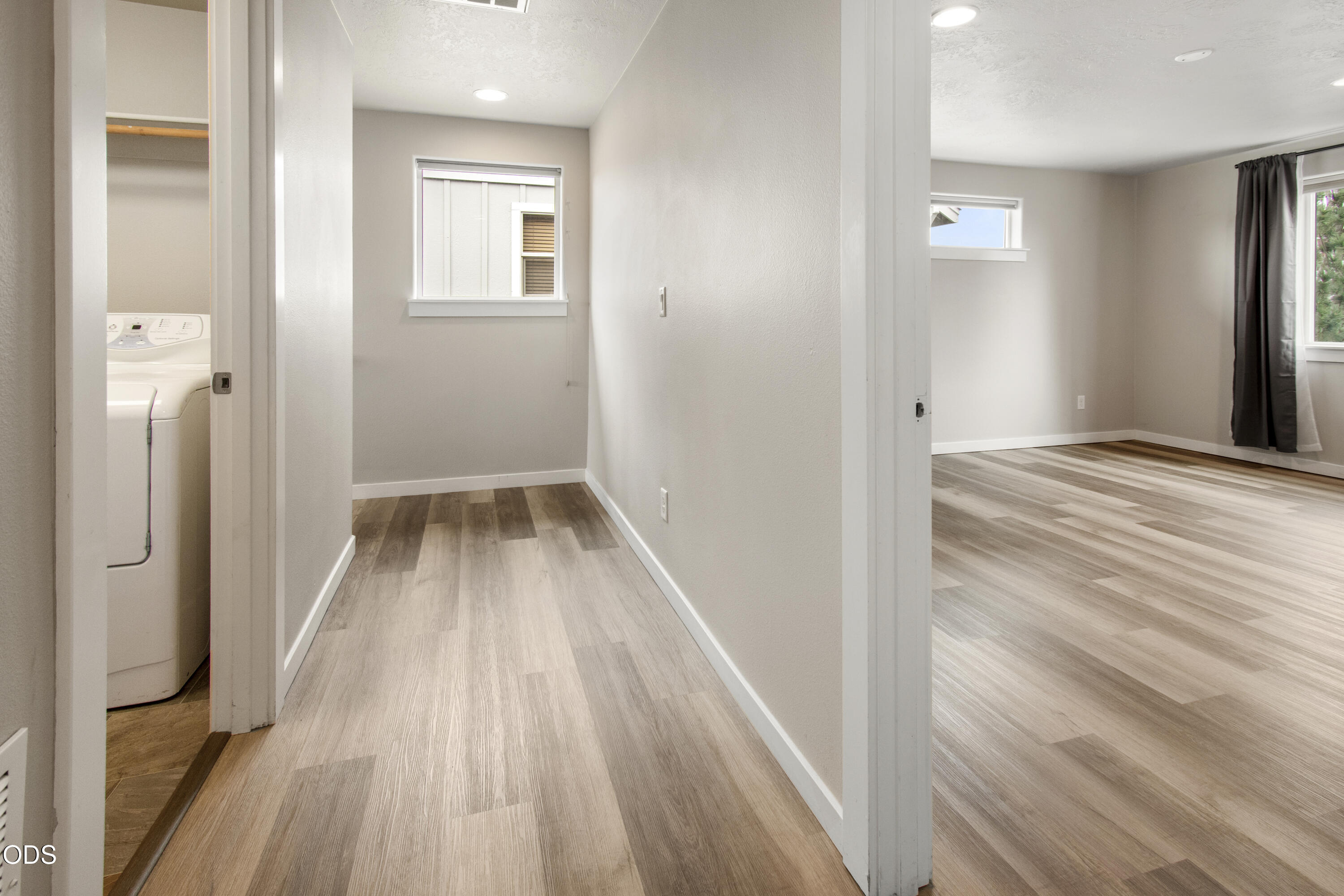 21332 Oconnor Way Bend, OR 97701 - Photo 19 of 33 a view of a hallway with wooden floor and a bathroom