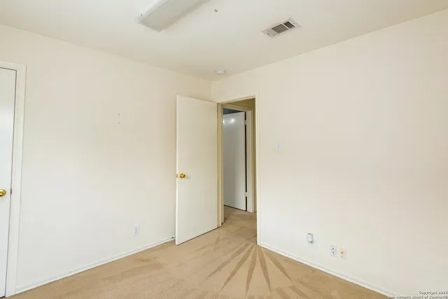 a bathroom with a sink mirror and vanity